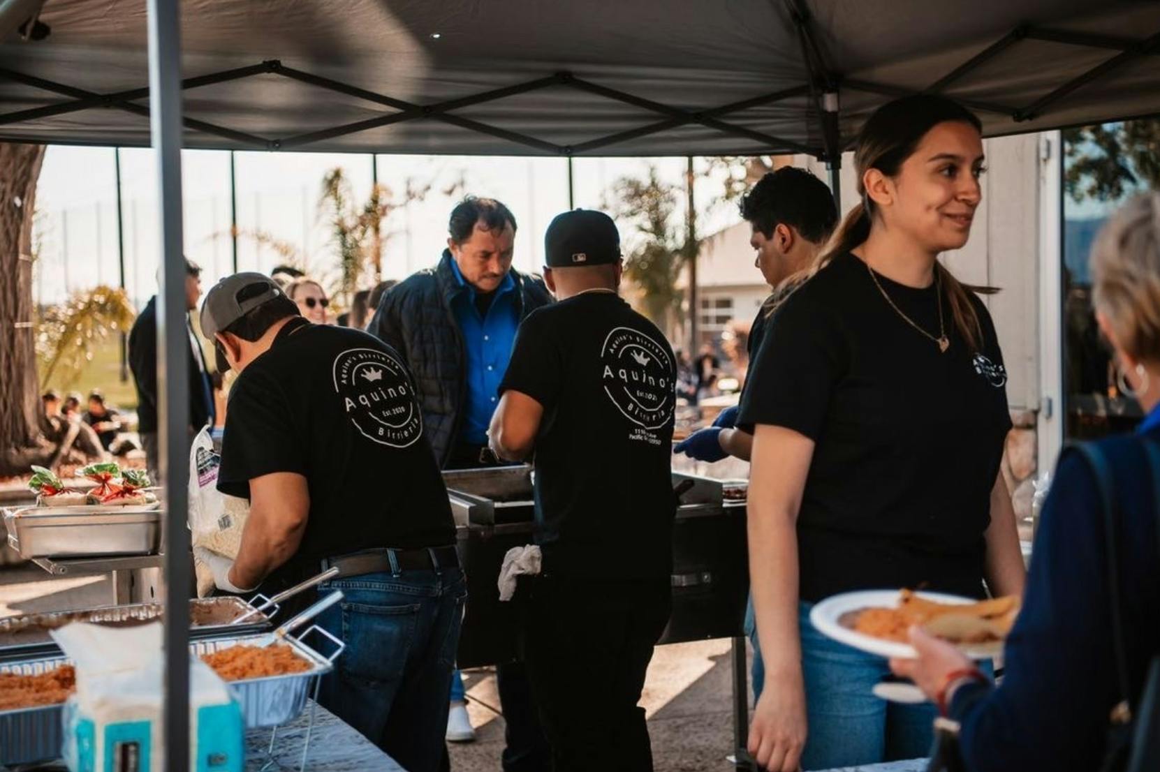 Customers being served at Aquino's Birrieria.