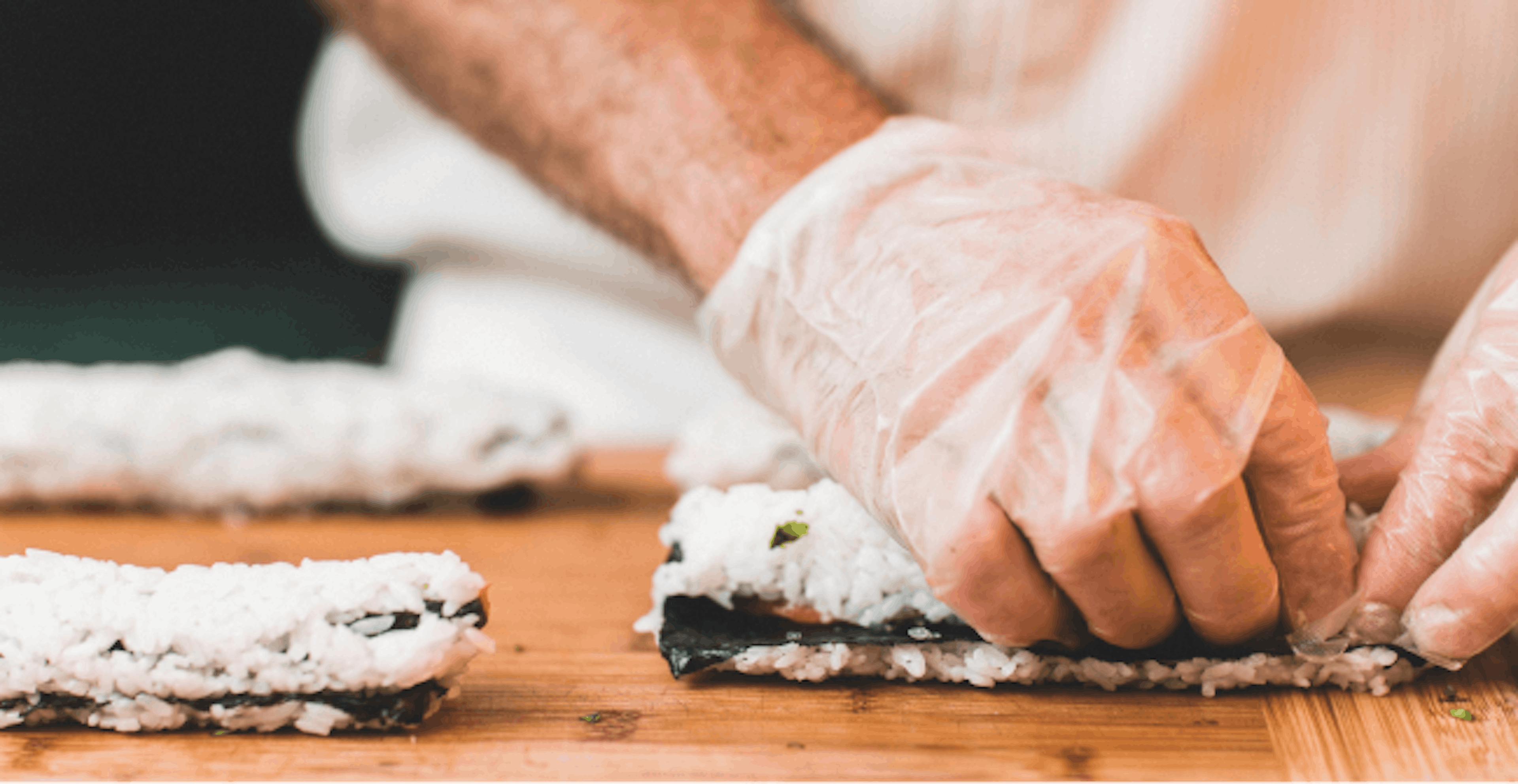 Image of a restaurant employee preparing food