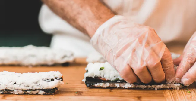 Image of a restaurant employee preparing food