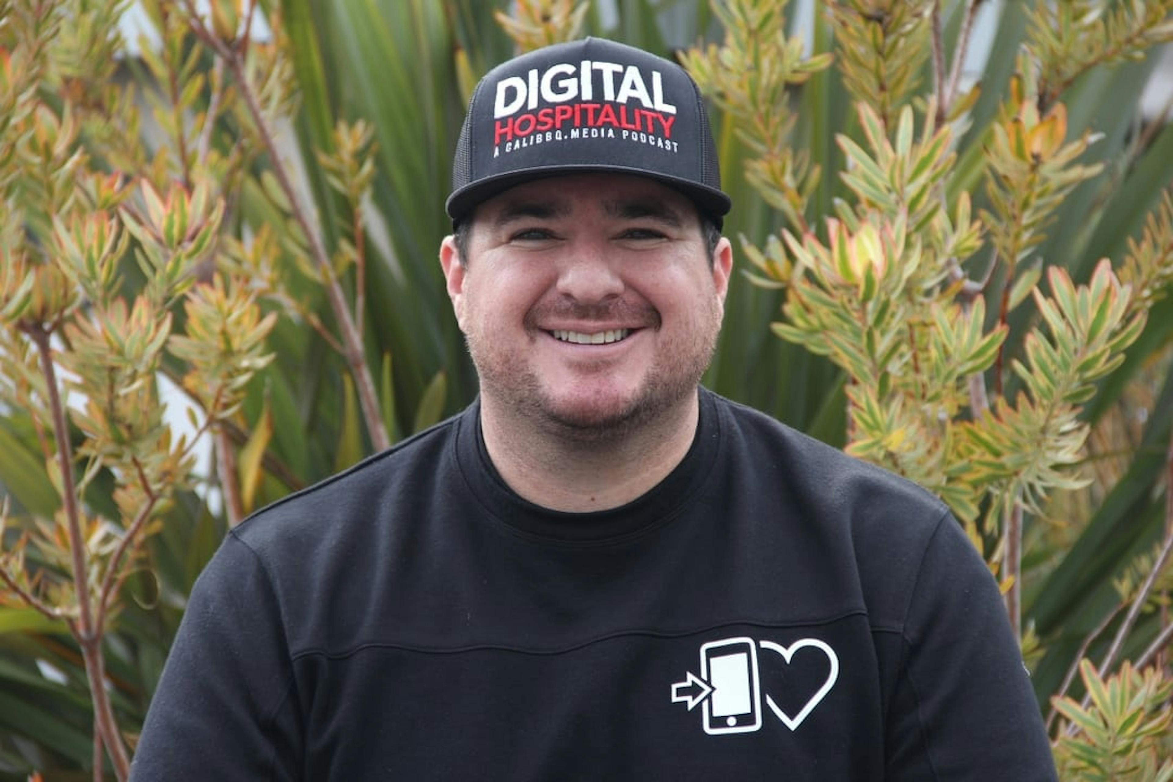 Image of Shawn Walchef, owner of Cali BBQ, smiling for the camera