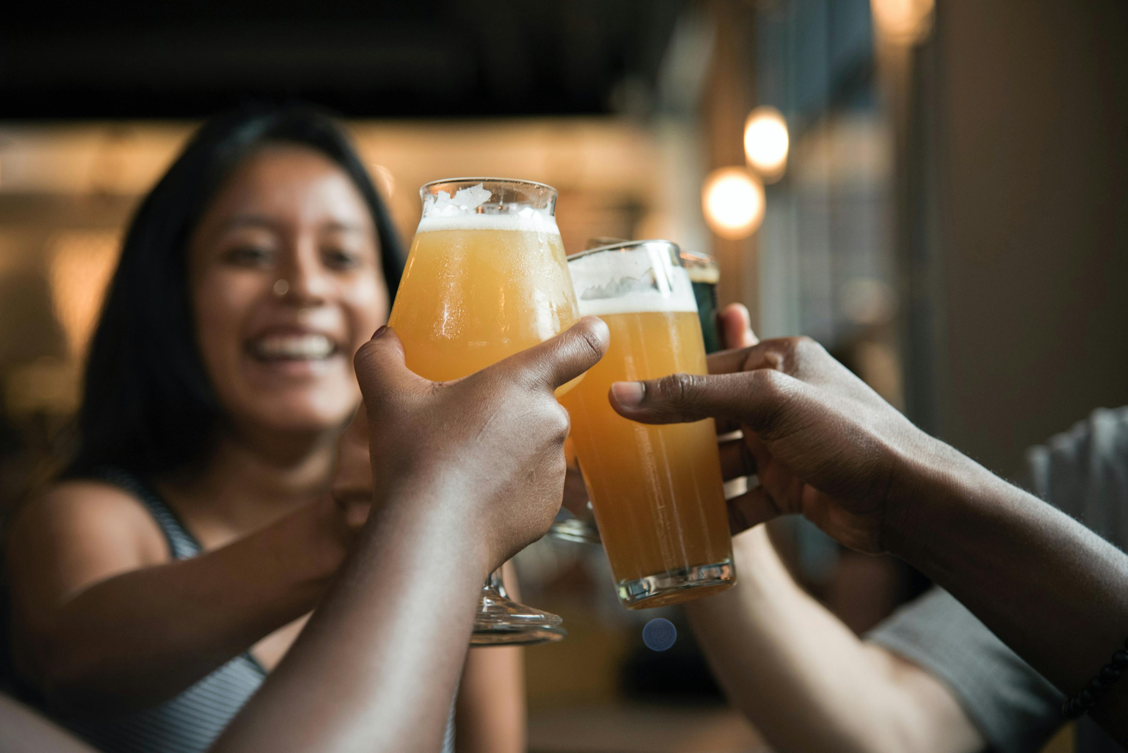 Group of friends cheersing at a reopened restaurant