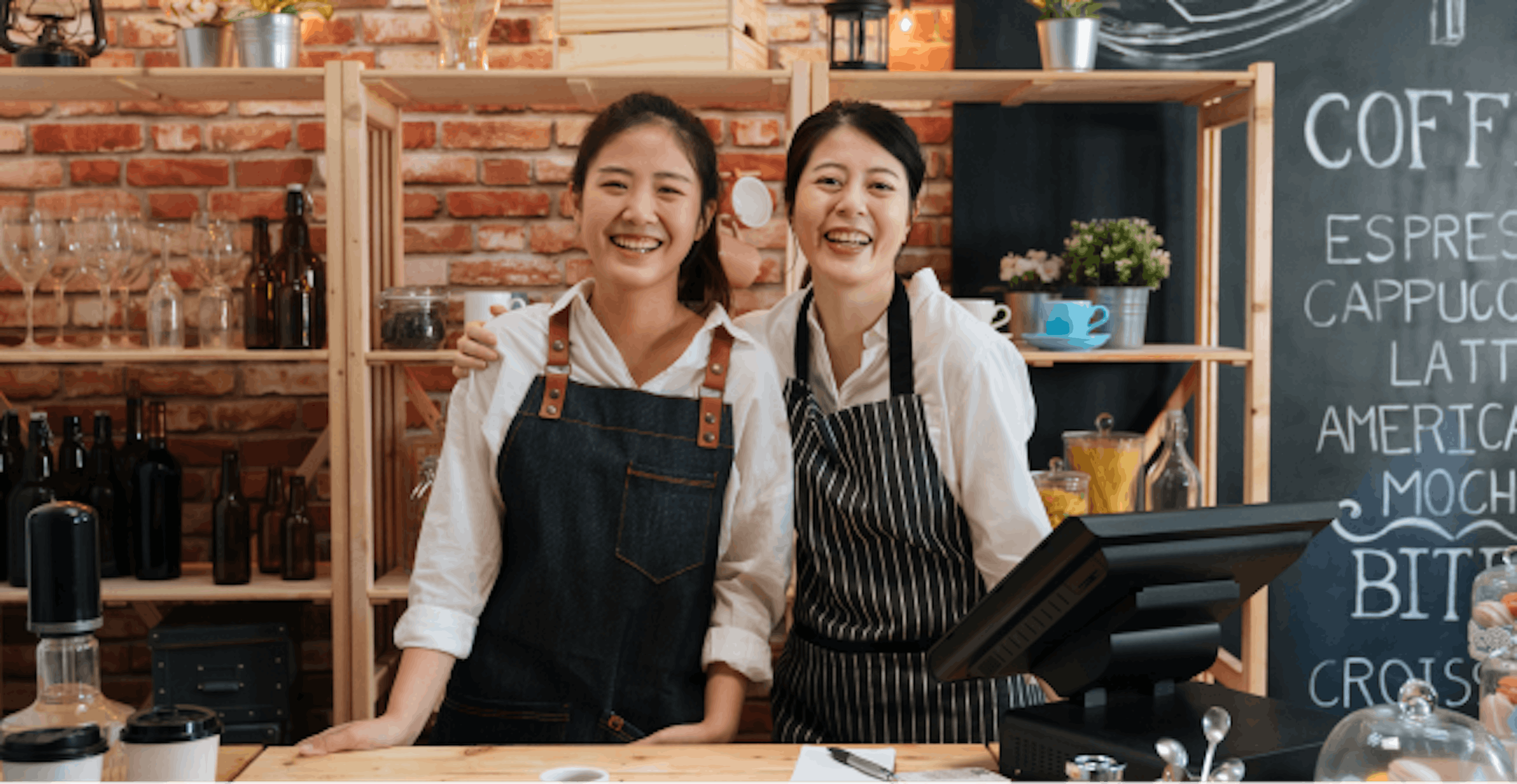 Image of two women working in a coffee shop 