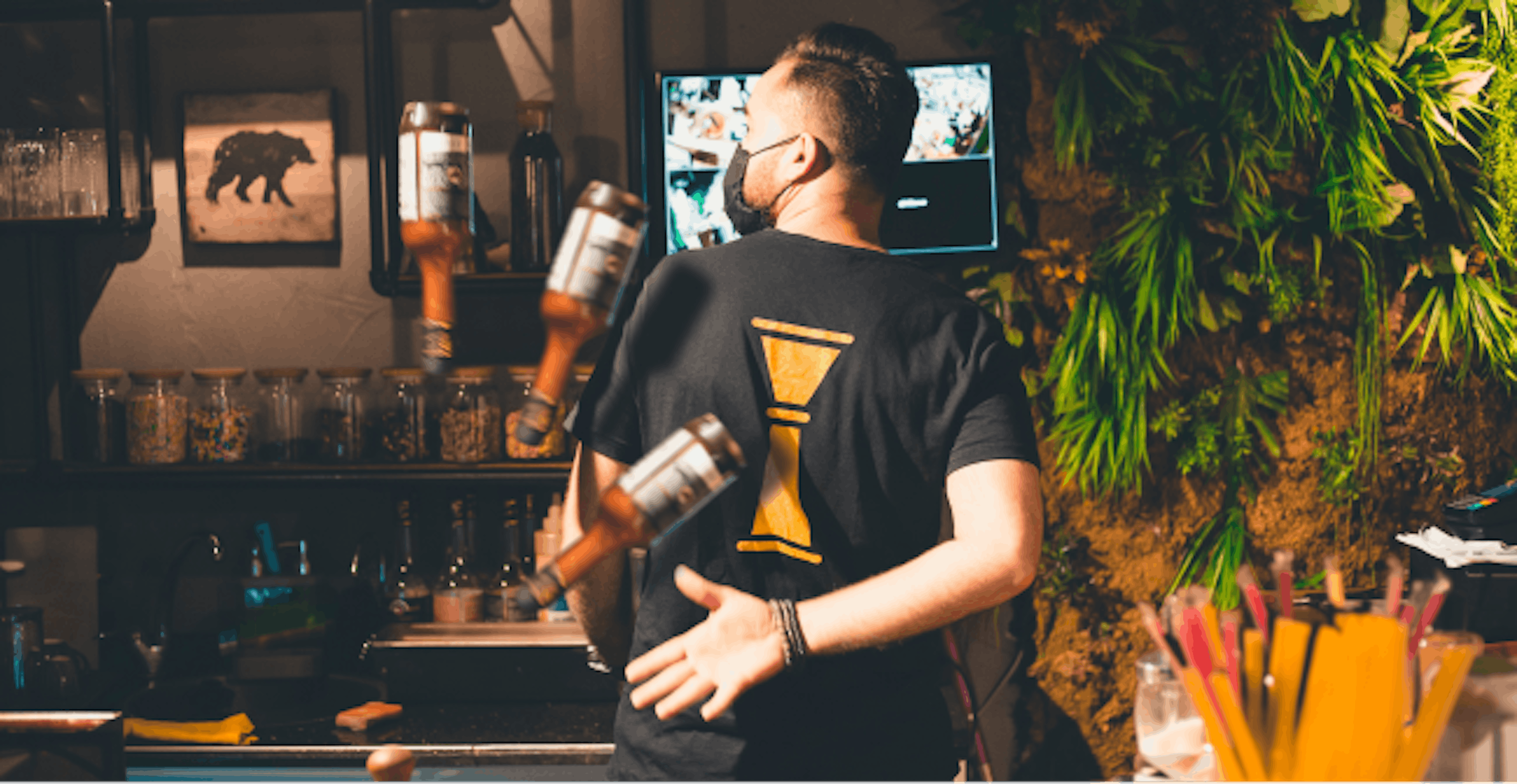 Image of a bartender making a drink in a restaurant 