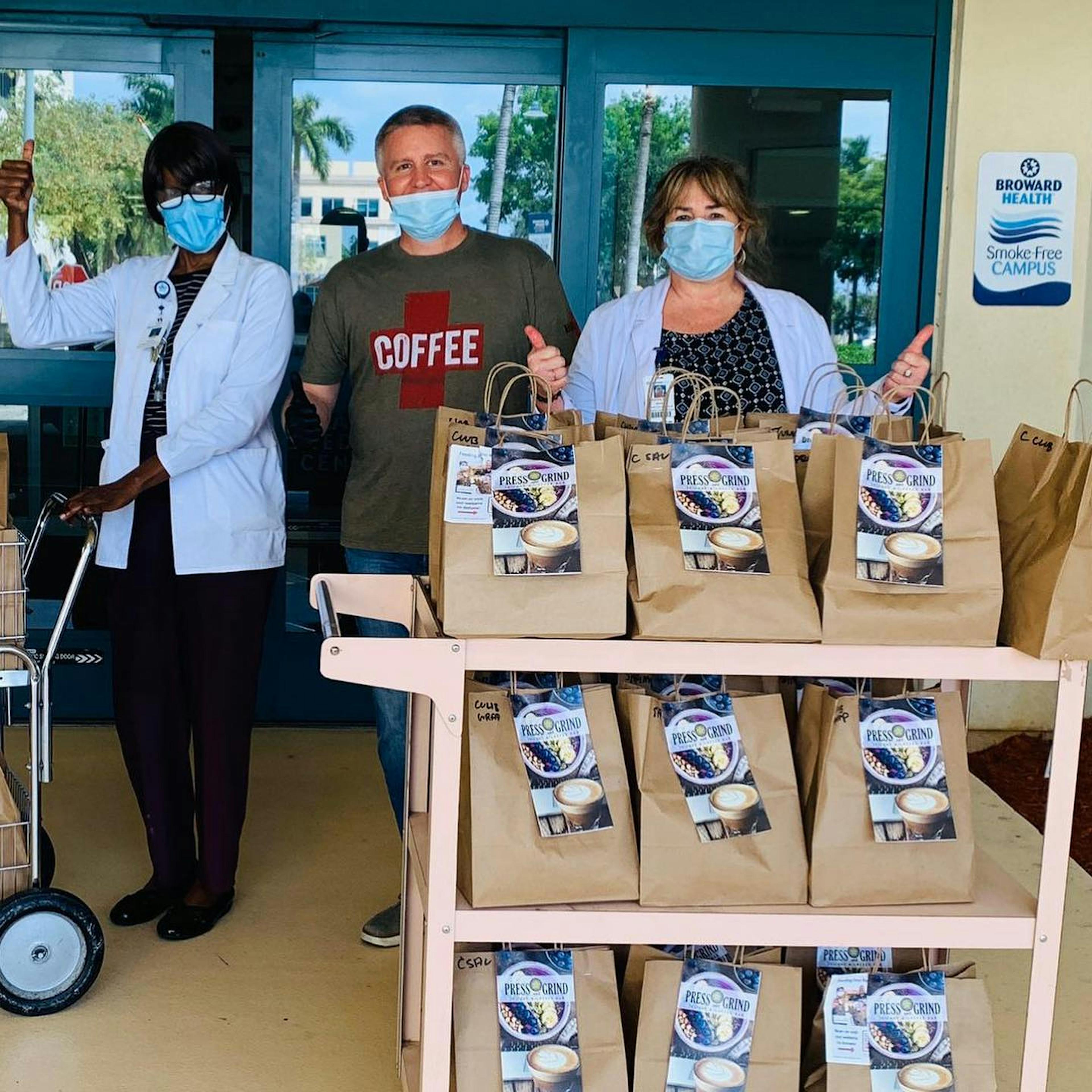 Joe Sloboda of Press & Grind Café dropping off coffee to healthcare workers during COVID-19