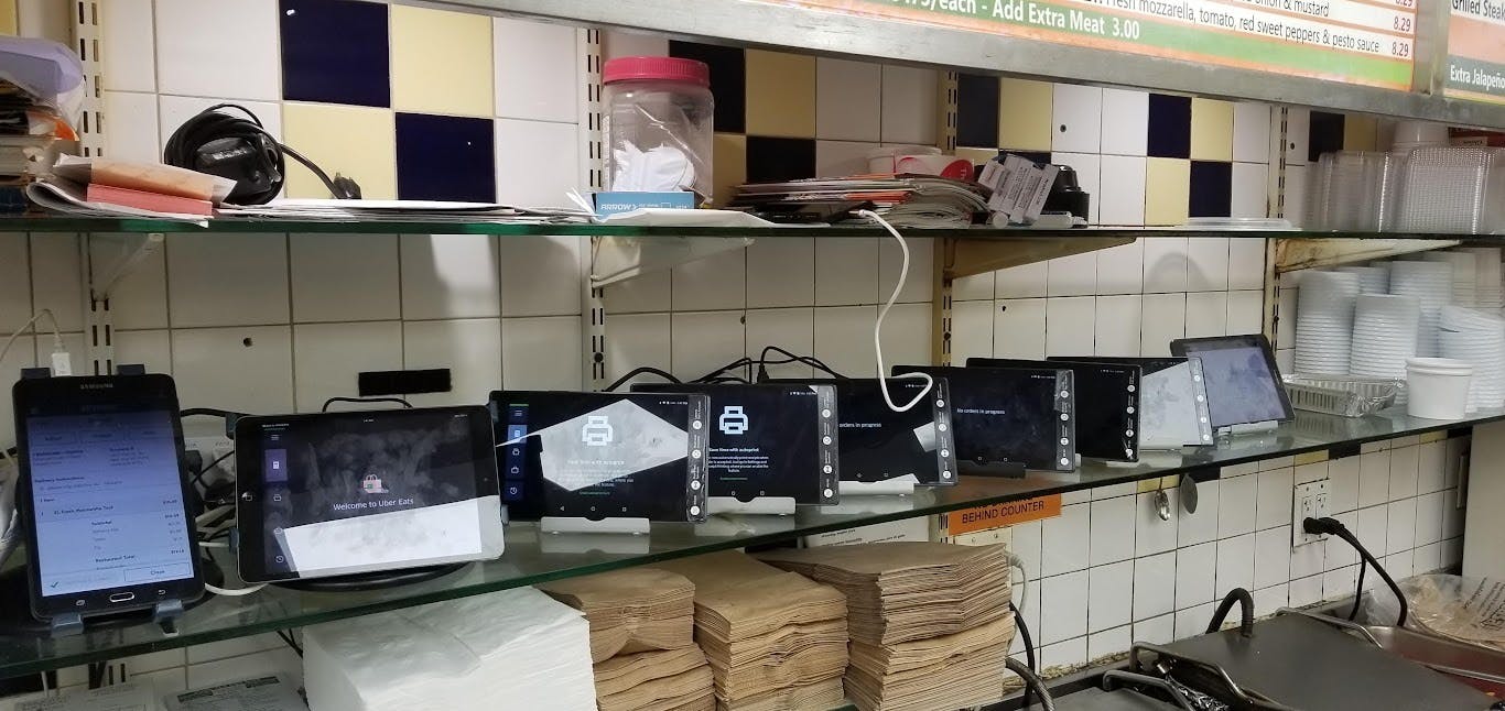 A line of restaurant POS systems at Panini Grill.