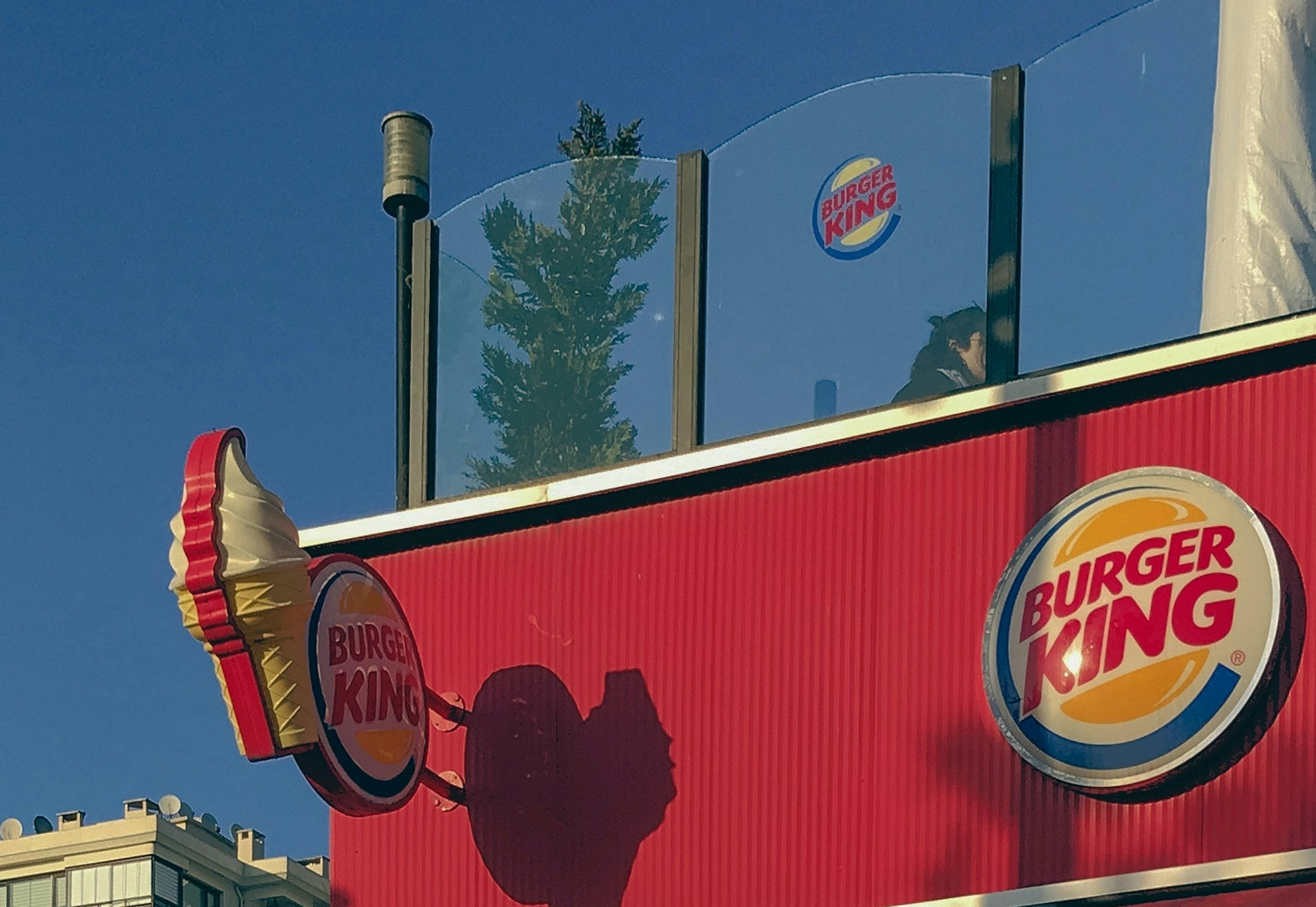 Outside a Burger King franchise with a roof. 