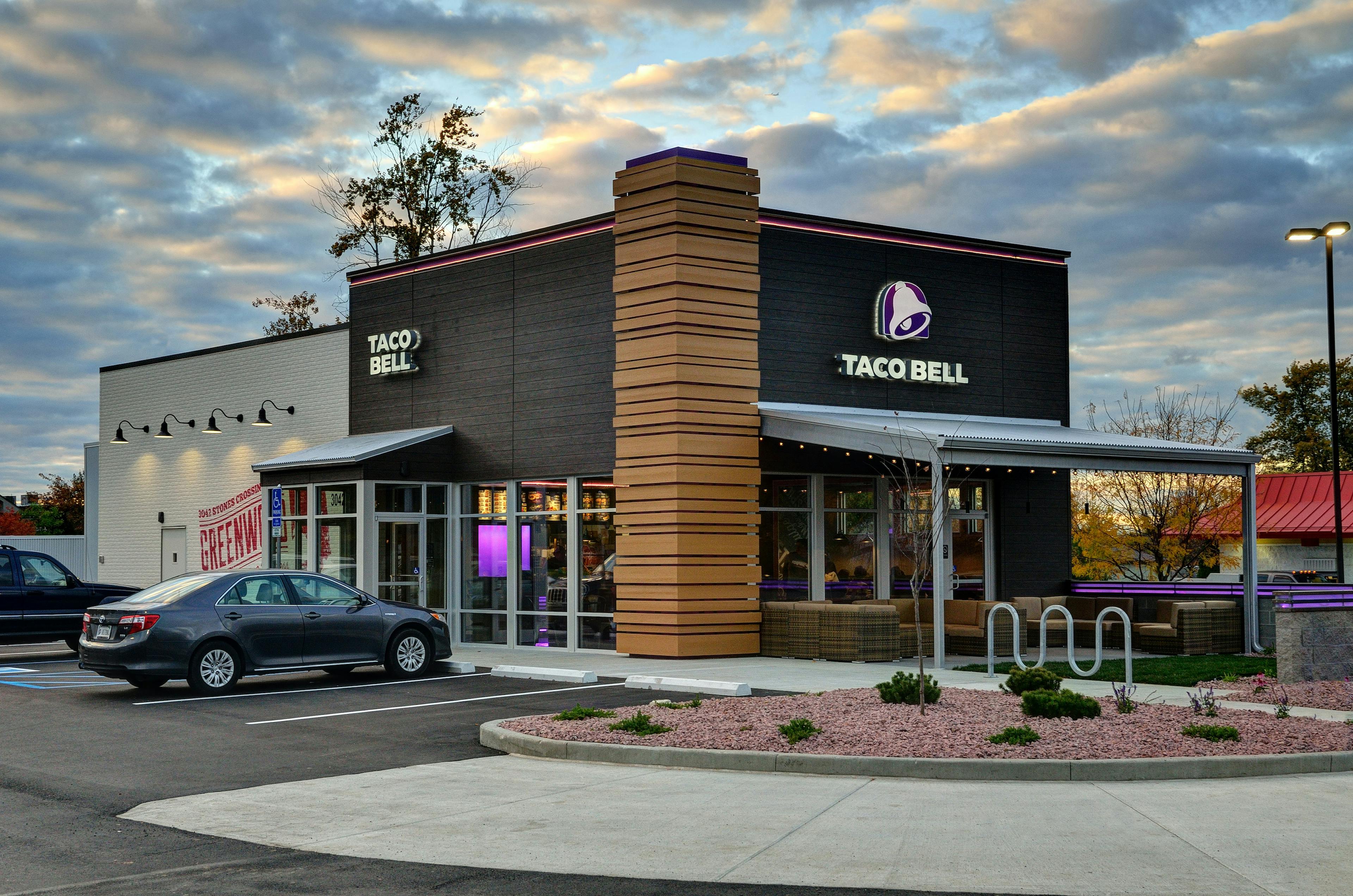 Outside a Taco Bell franchise with parking lot. 