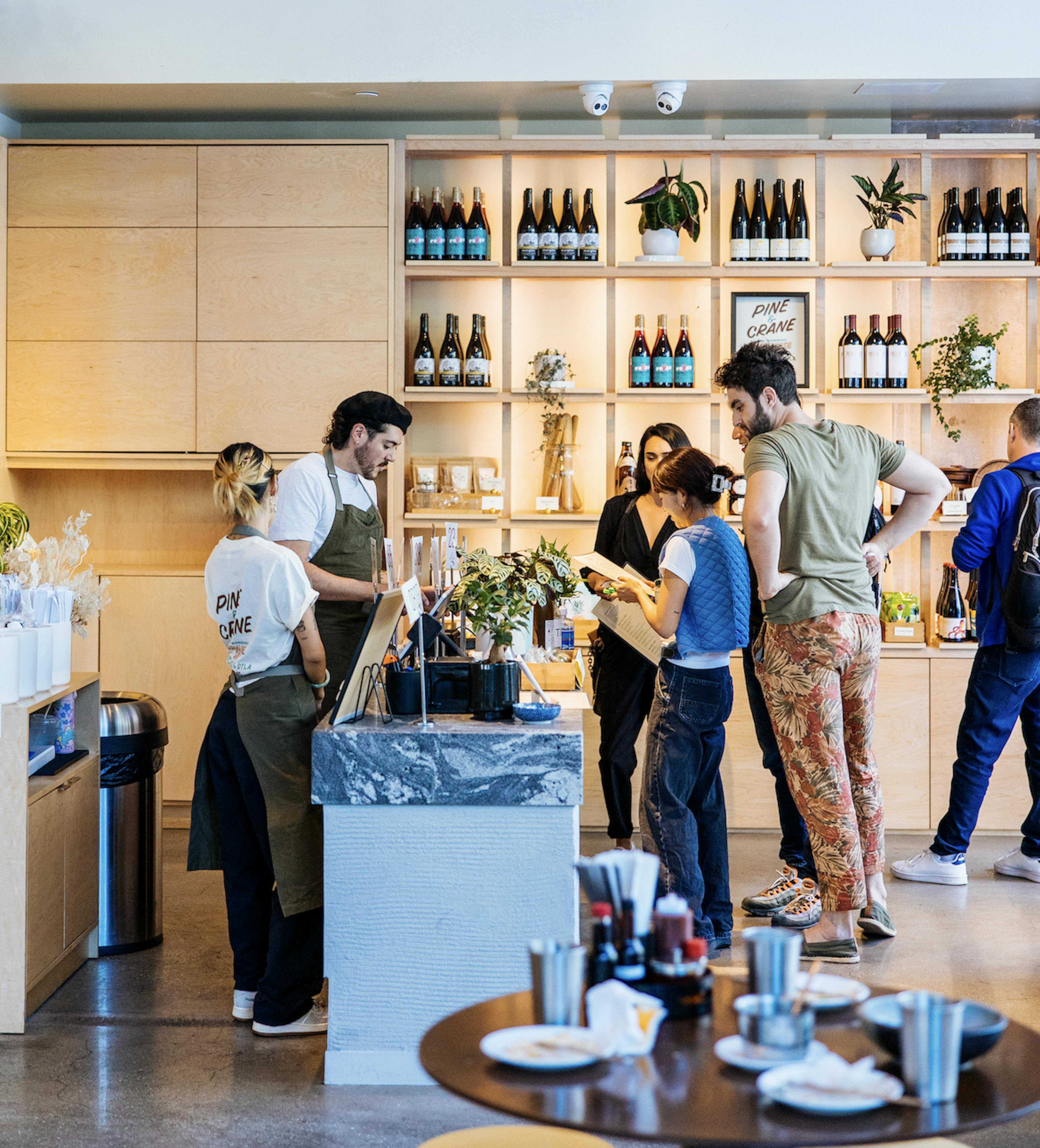 Image of restaurant guests at the counter ordering