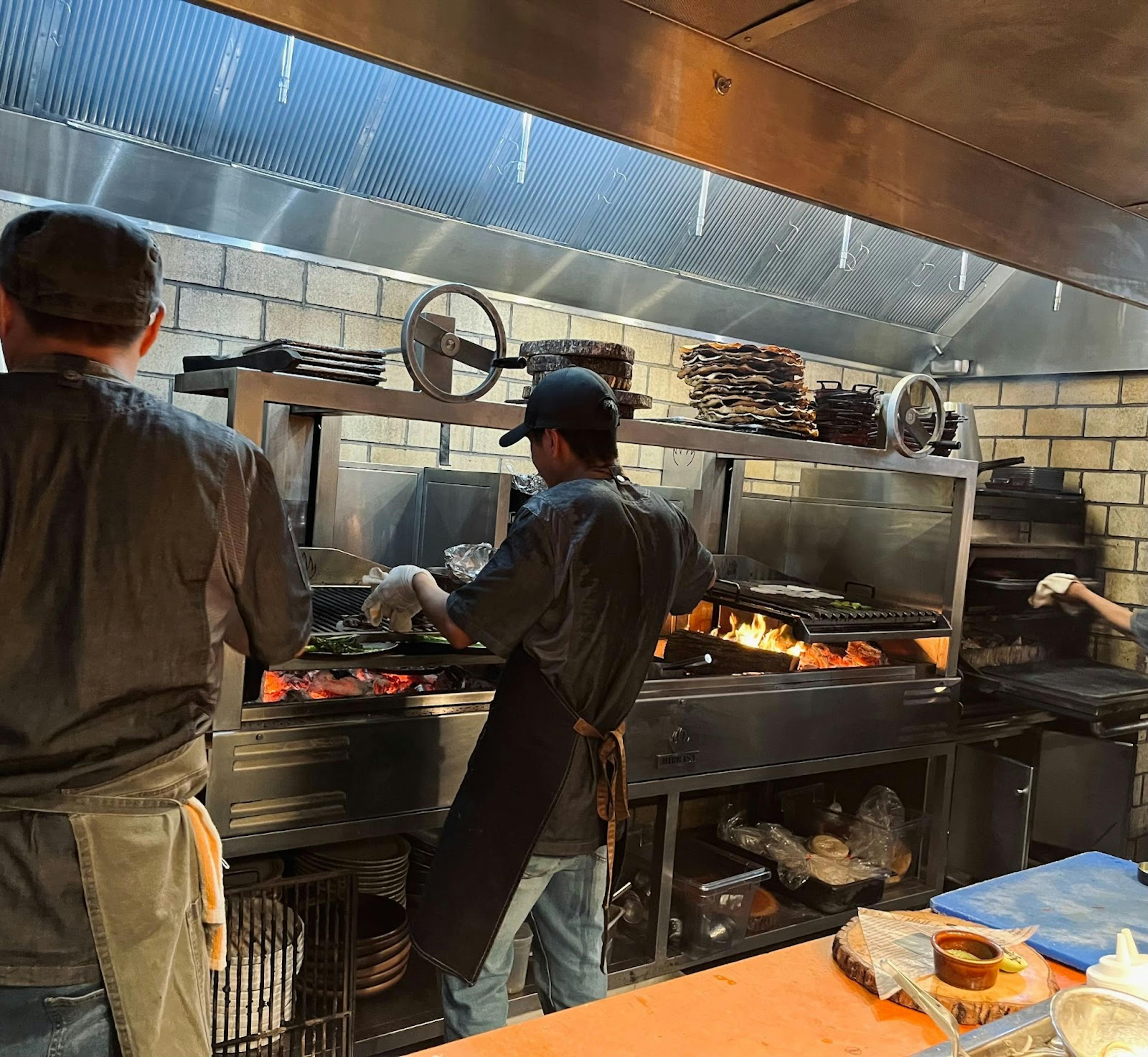 dLeña employees preparing food on the line