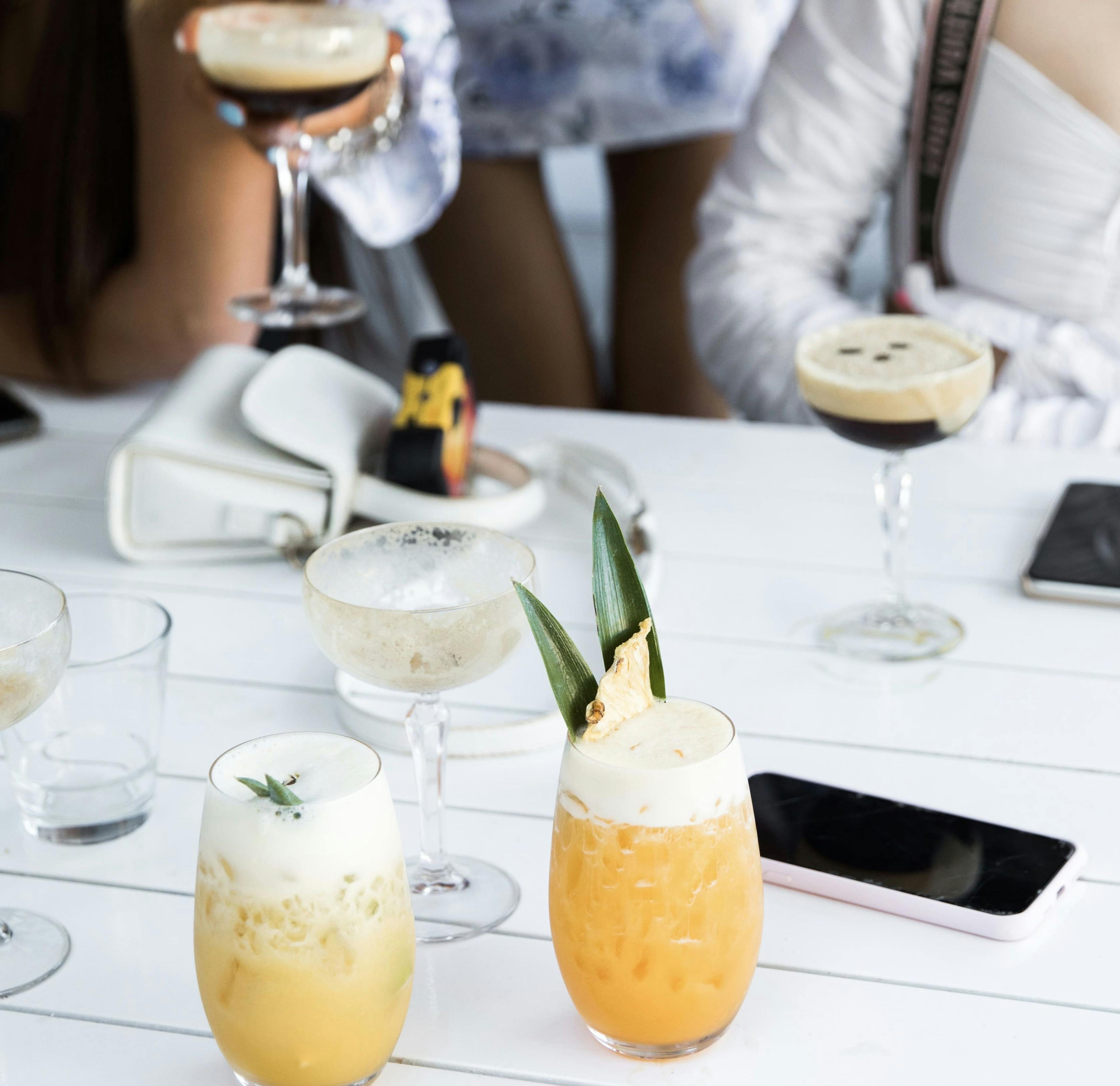 Image of two summer cocktails on a tablescape