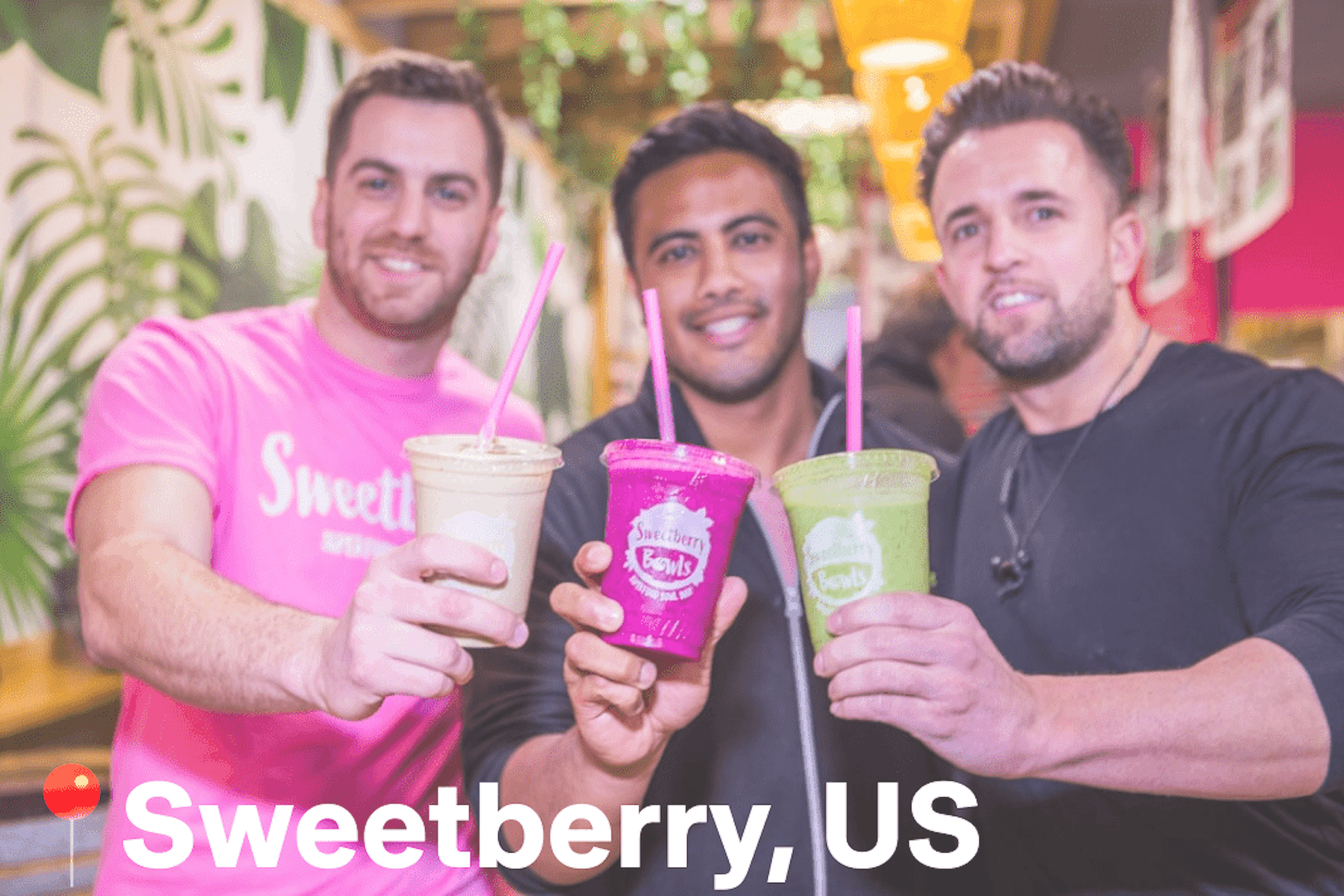 Image of three Sweetberry employees cheersing their smoothies