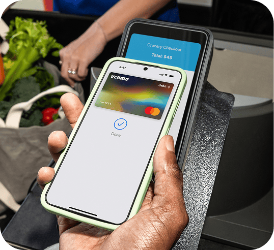 A payment being made with a mobile phone via tap.