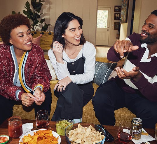 People at a party enjoying food