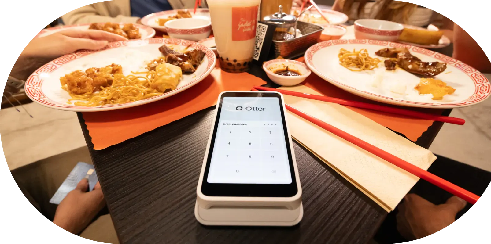 POS in small restaurant, with food and dishes in the background