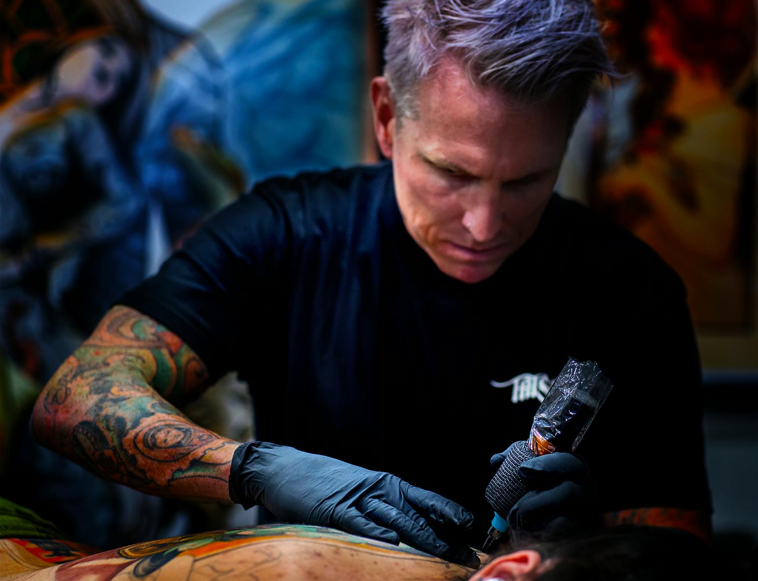 Tattoo artist working