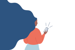 A woman looks at her phone.