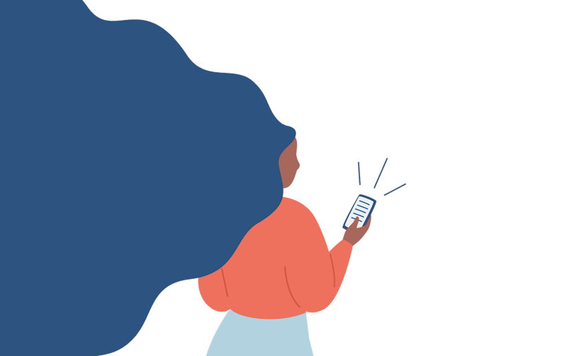 A woman looks at her phone.