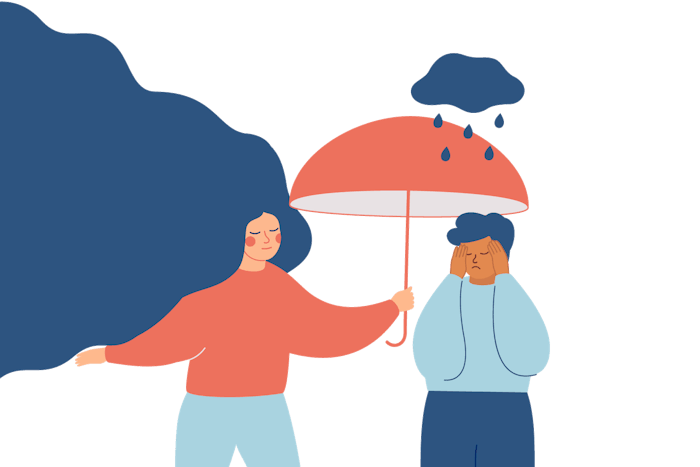 A person holding an umbrella over a person in distress.