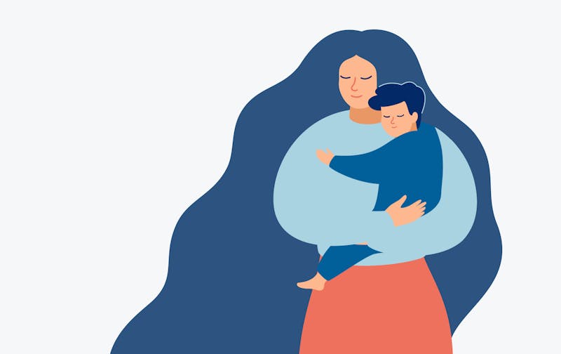 A woman holds her child.