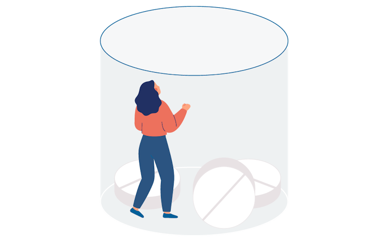 A person stuck in a glass. On the bottom of the glass there are pills.