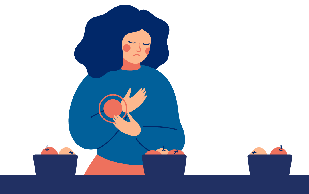 Kona horfir niðurlút á skálar af mat. 