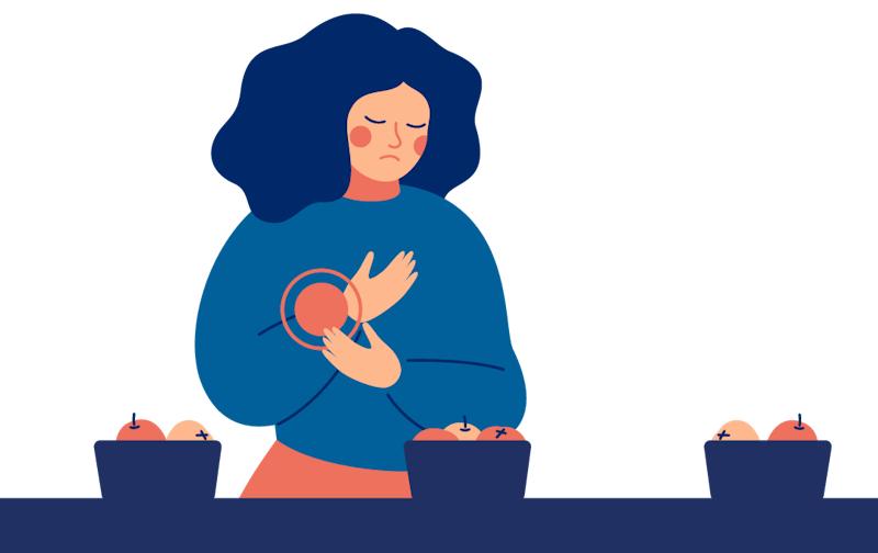 Kona horfir niðurlút á skálar af mat.