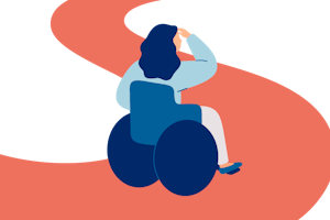 Osoba na wózku inwalidzkim patrzy w drogę przed siebie.