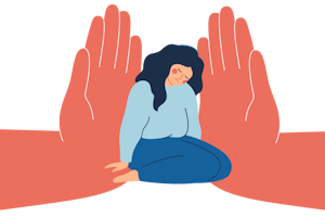 A woman sits on the floor with a sad expression. Two giant hands press on her from both sides.