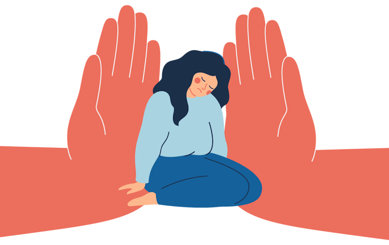 A woman sits on the floor with a sad expression. Two giant hands press on her from both sides.