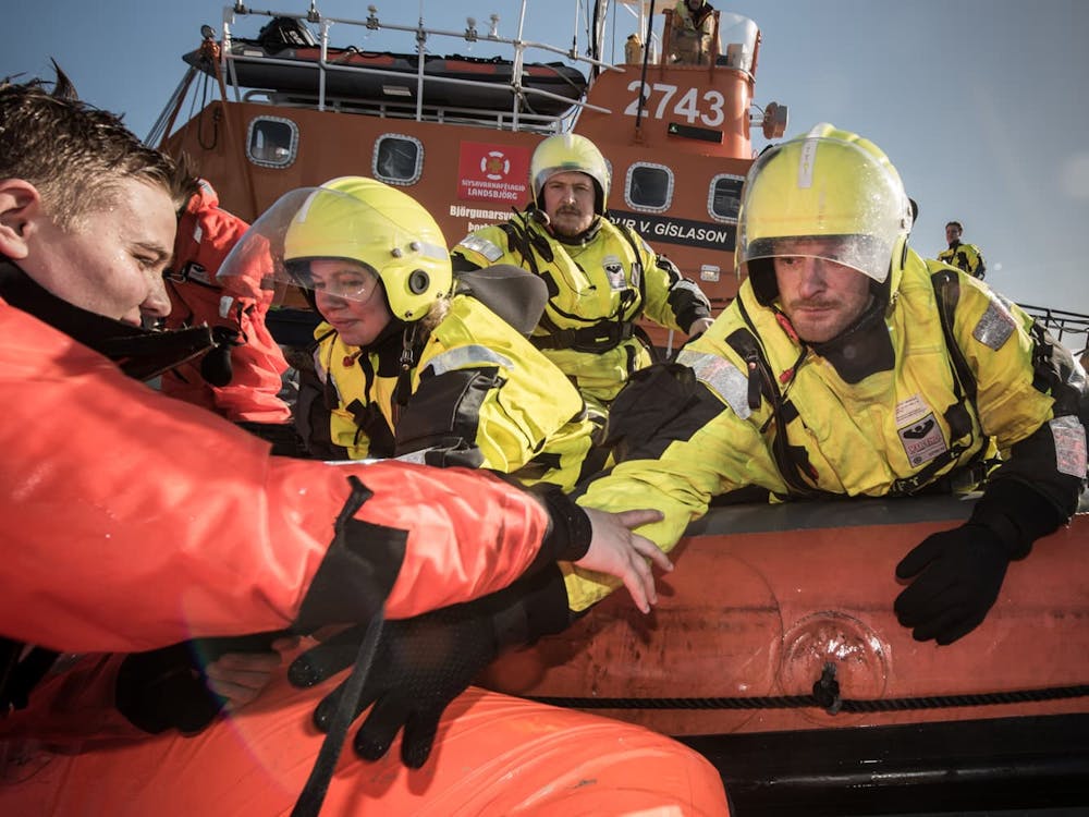 search and rescue squad rescuing a seafarer