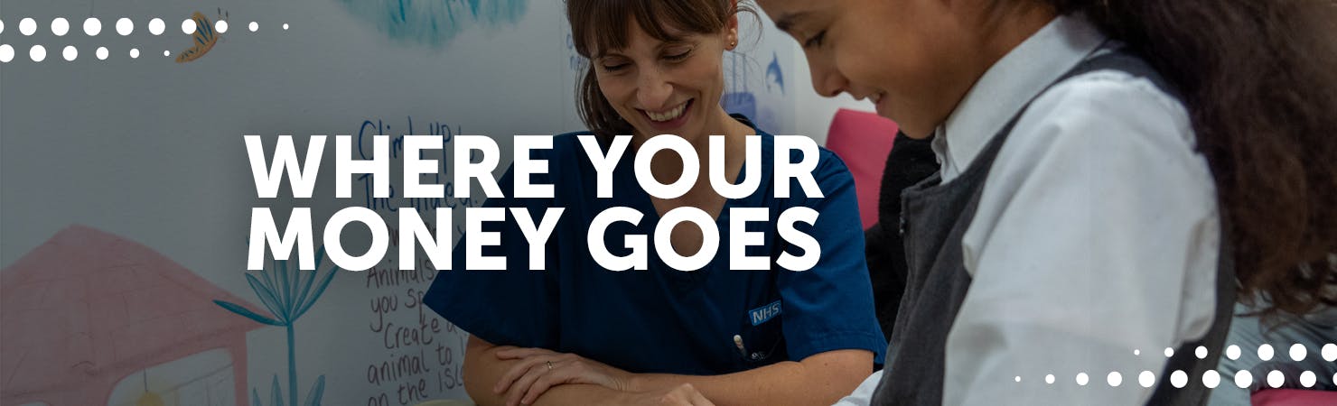 Nurse smiling, with young girl patient, also smiling
