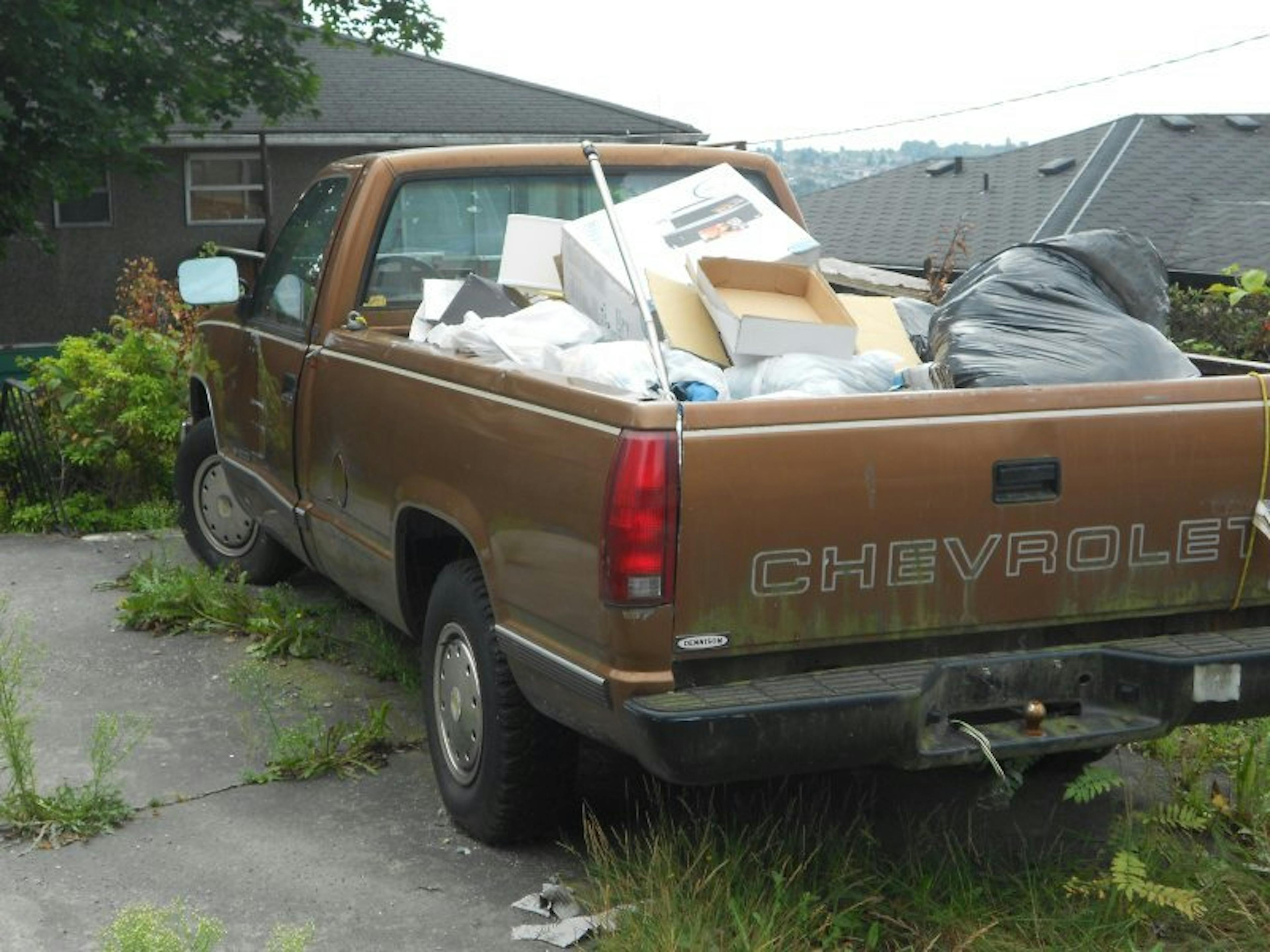 Nick's Auto Towing picking up a Chevy truck.