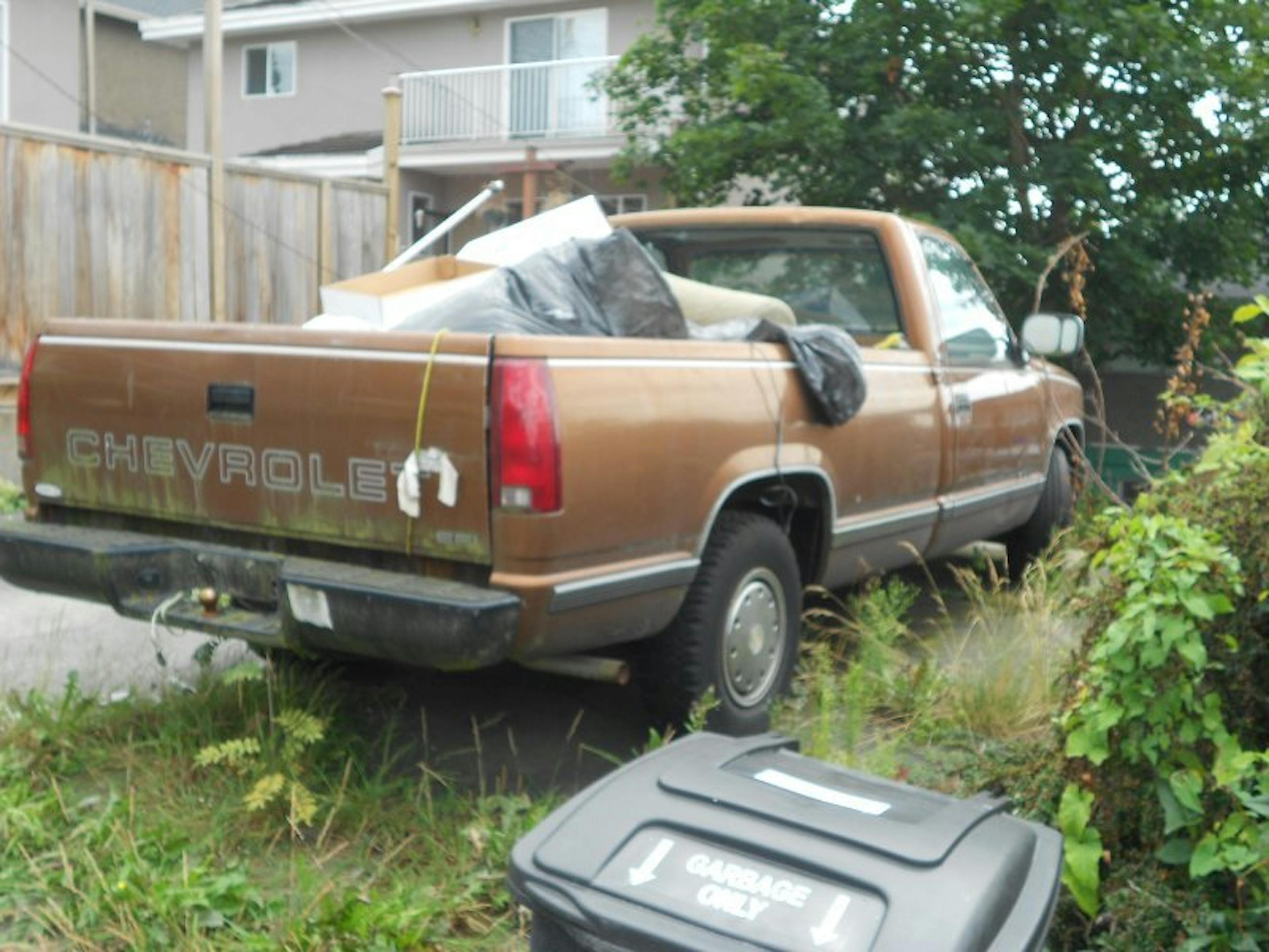 Nick's Auto Towing picking up a Chevy truck.