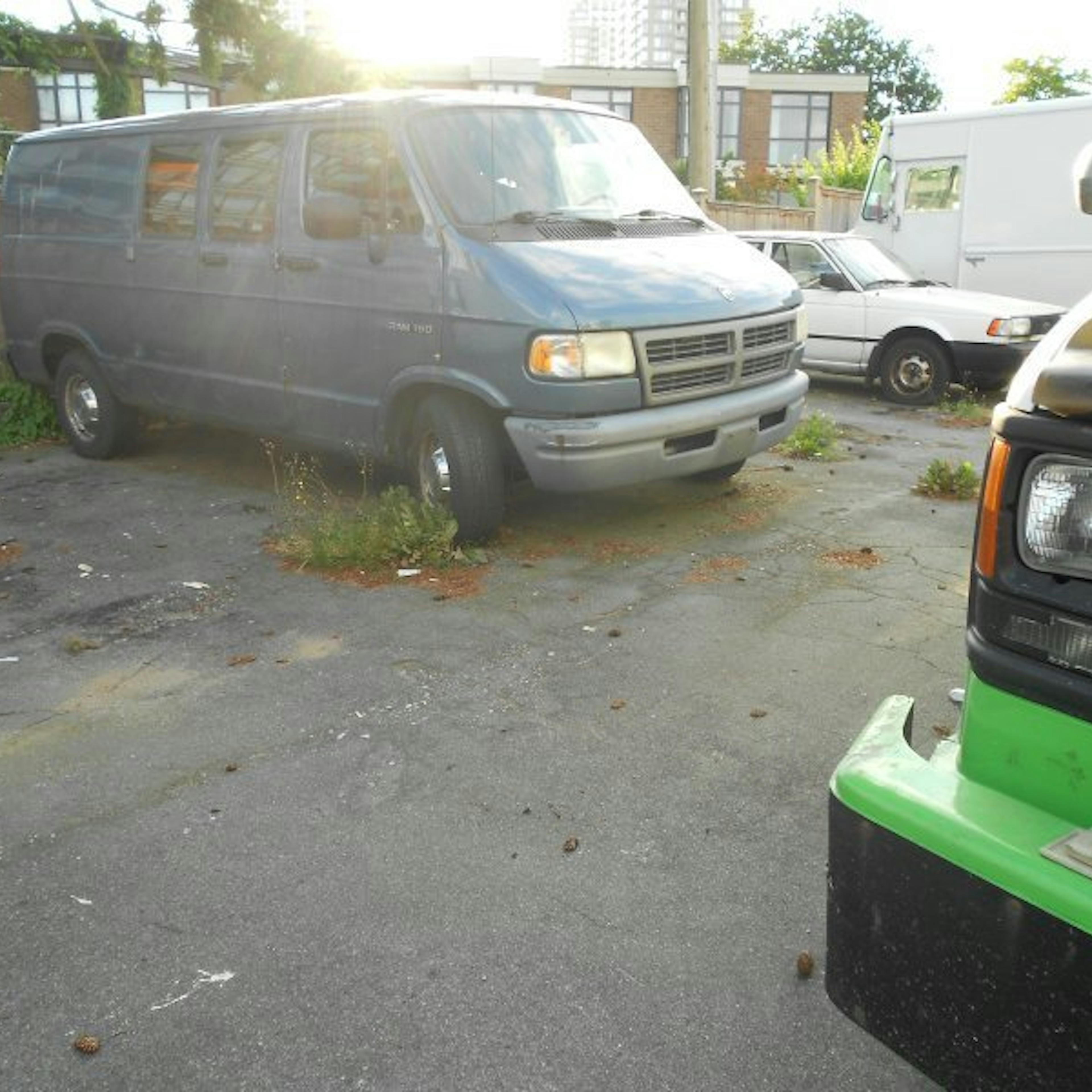 Nick's Auto Towing picking up a Dodge van.