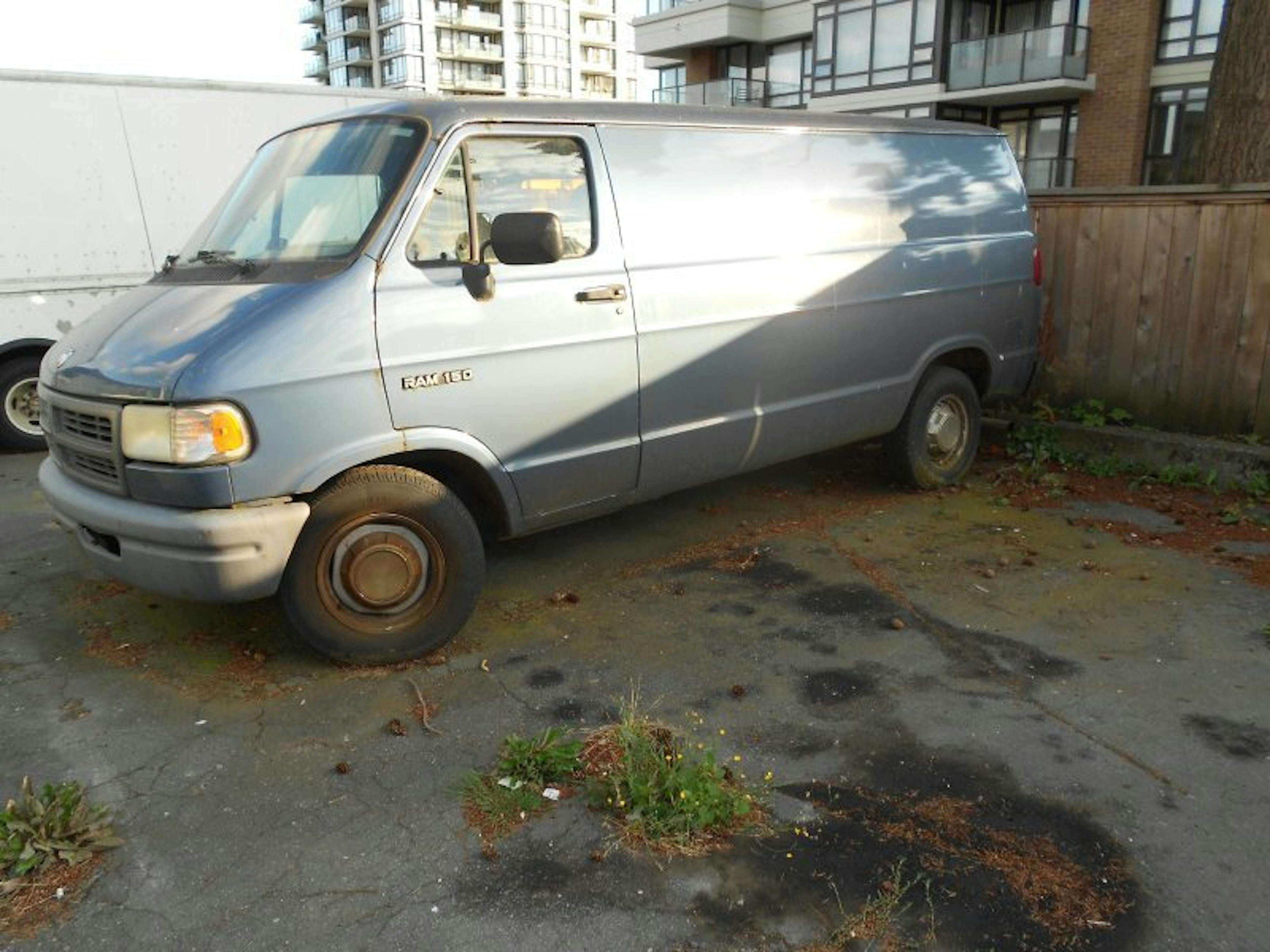 Nick's Auto Towing picking up a Dodge van.