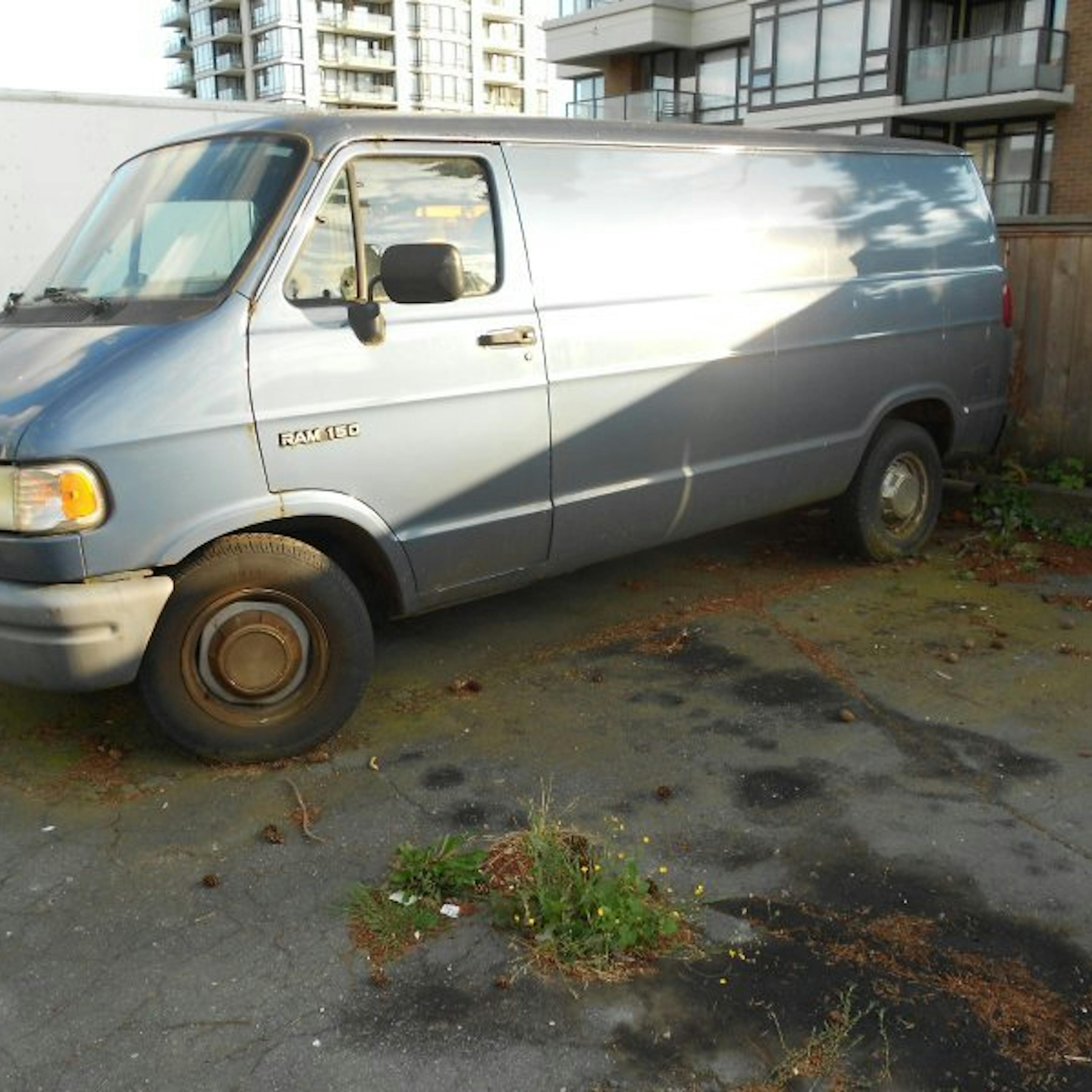 Nick's Auto Towing picking up a Dodge van.
