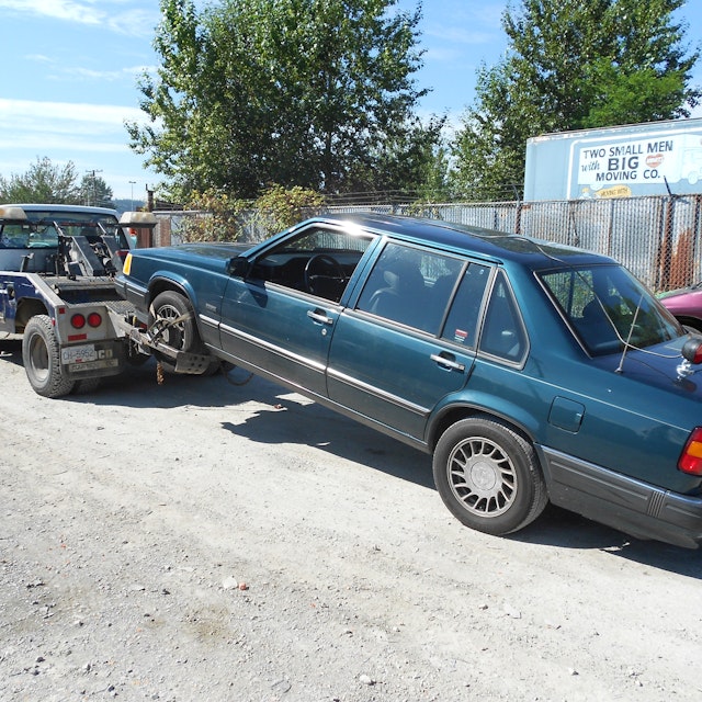 A Volvo being hauled by Nick's Auto Towing