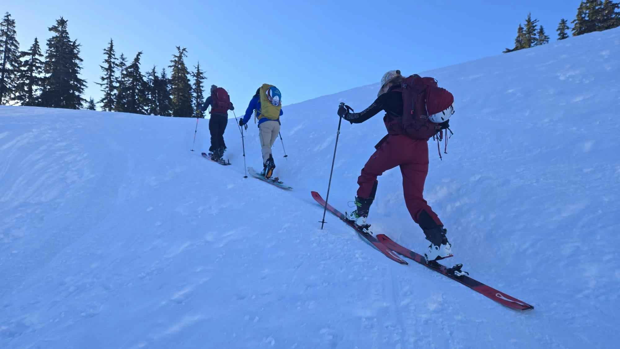 the group skis uphill