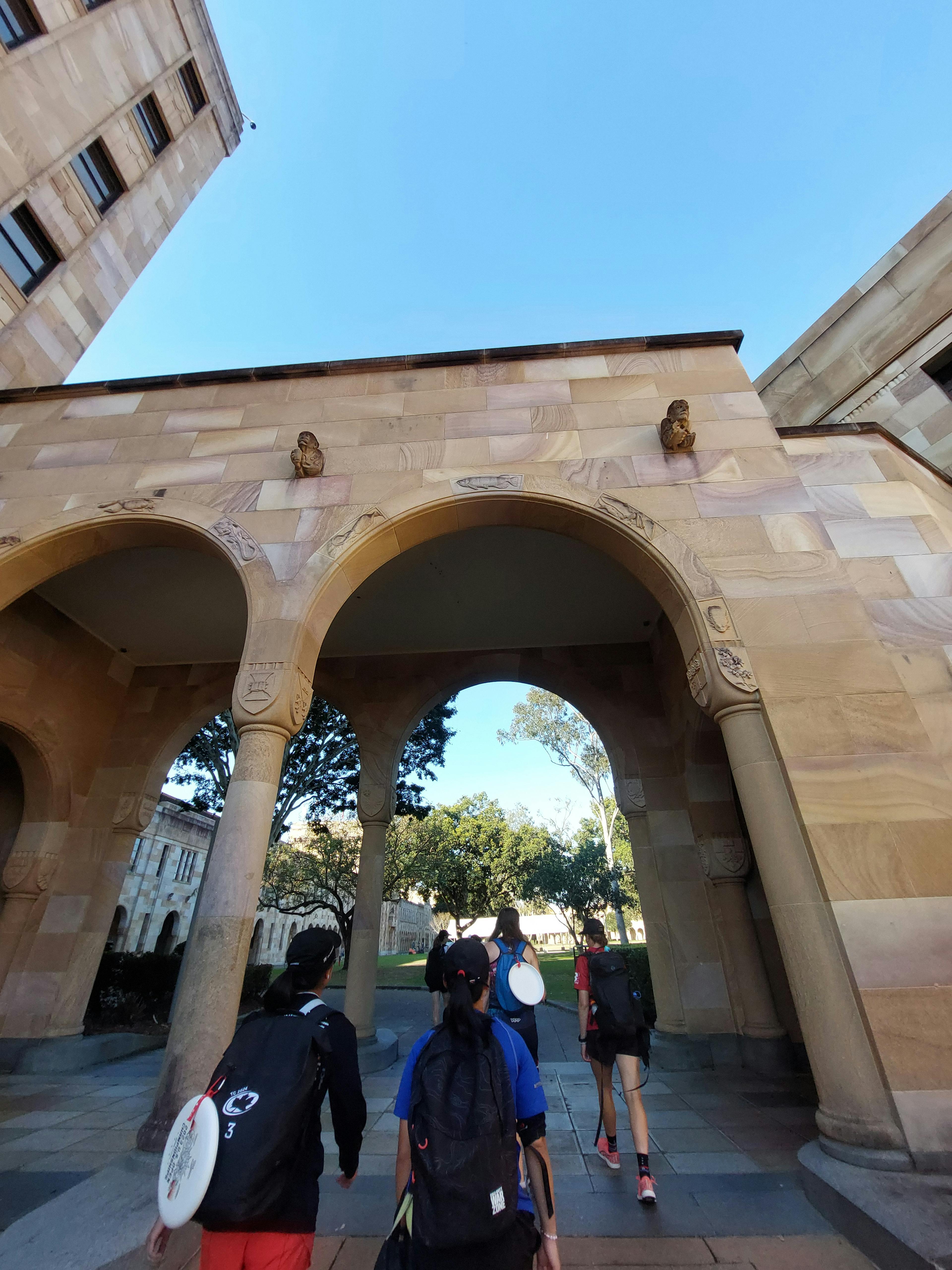 TCW players walking through an archway