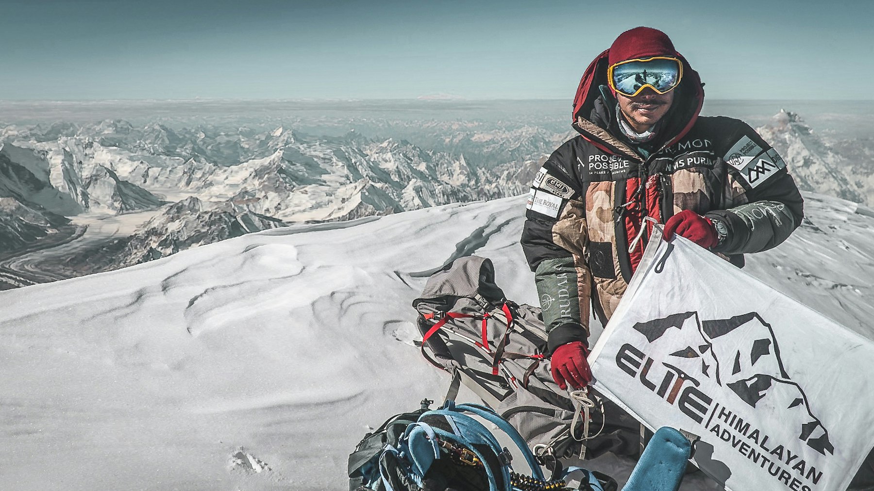 Nims stands on the summit of K2