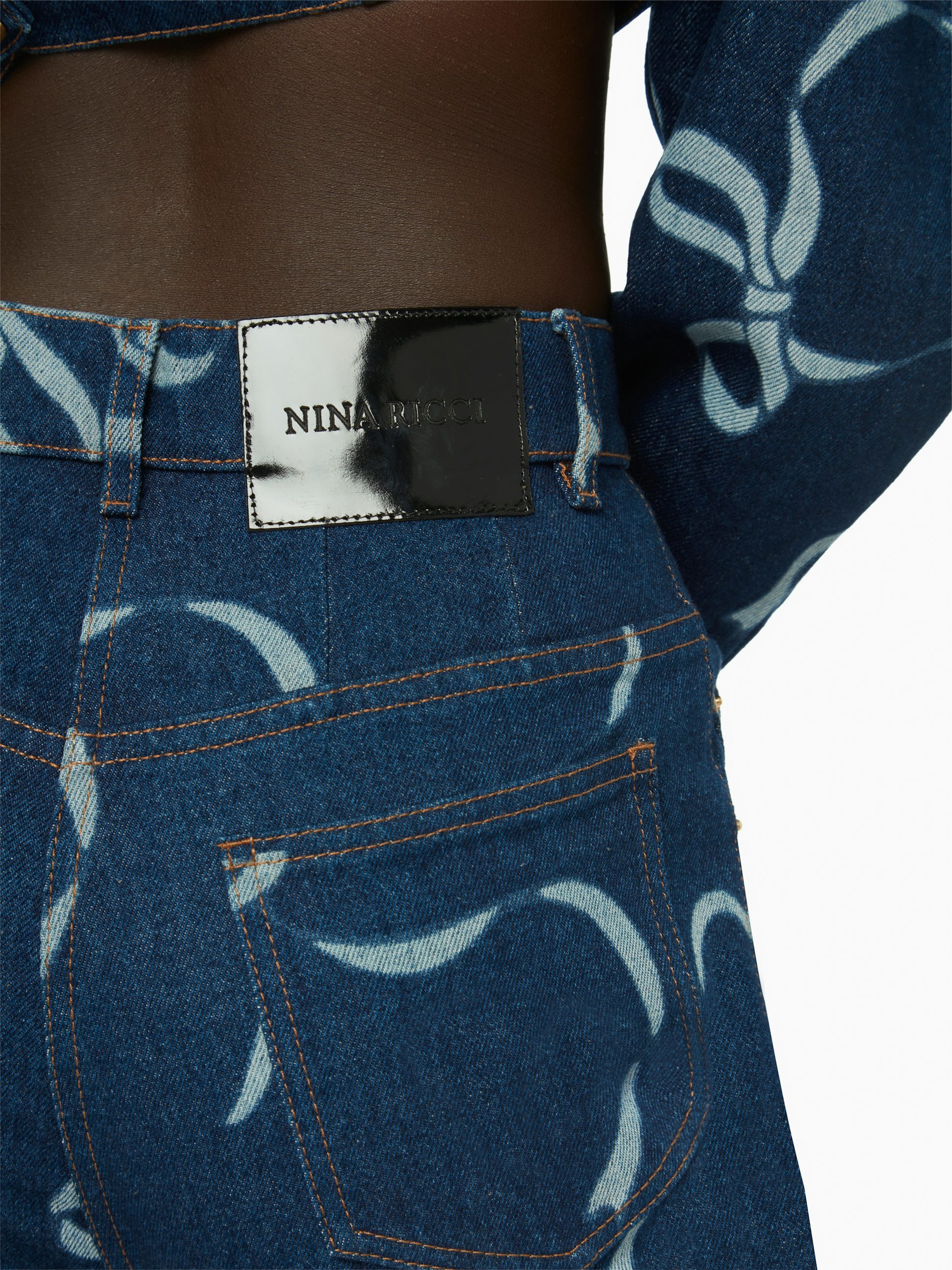 Bow-print exaggerated flare jeans in raw denim - Nina Ricci
