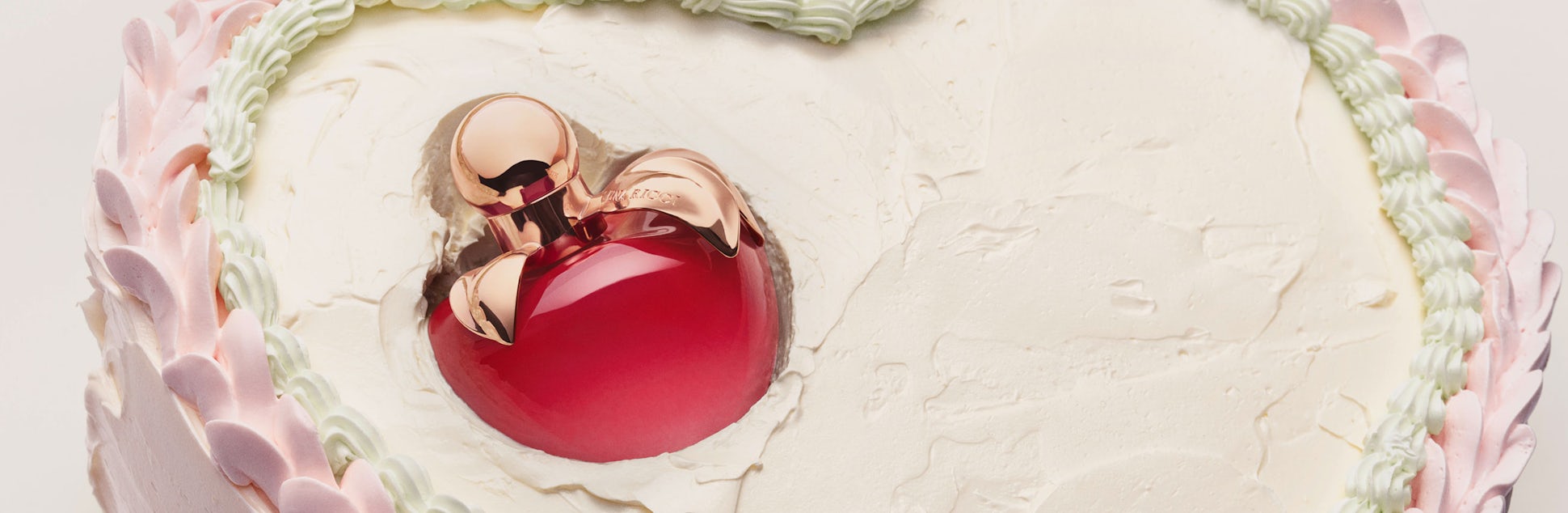 Nina Ricci's Nina Eau de Parfum on a birthday cake