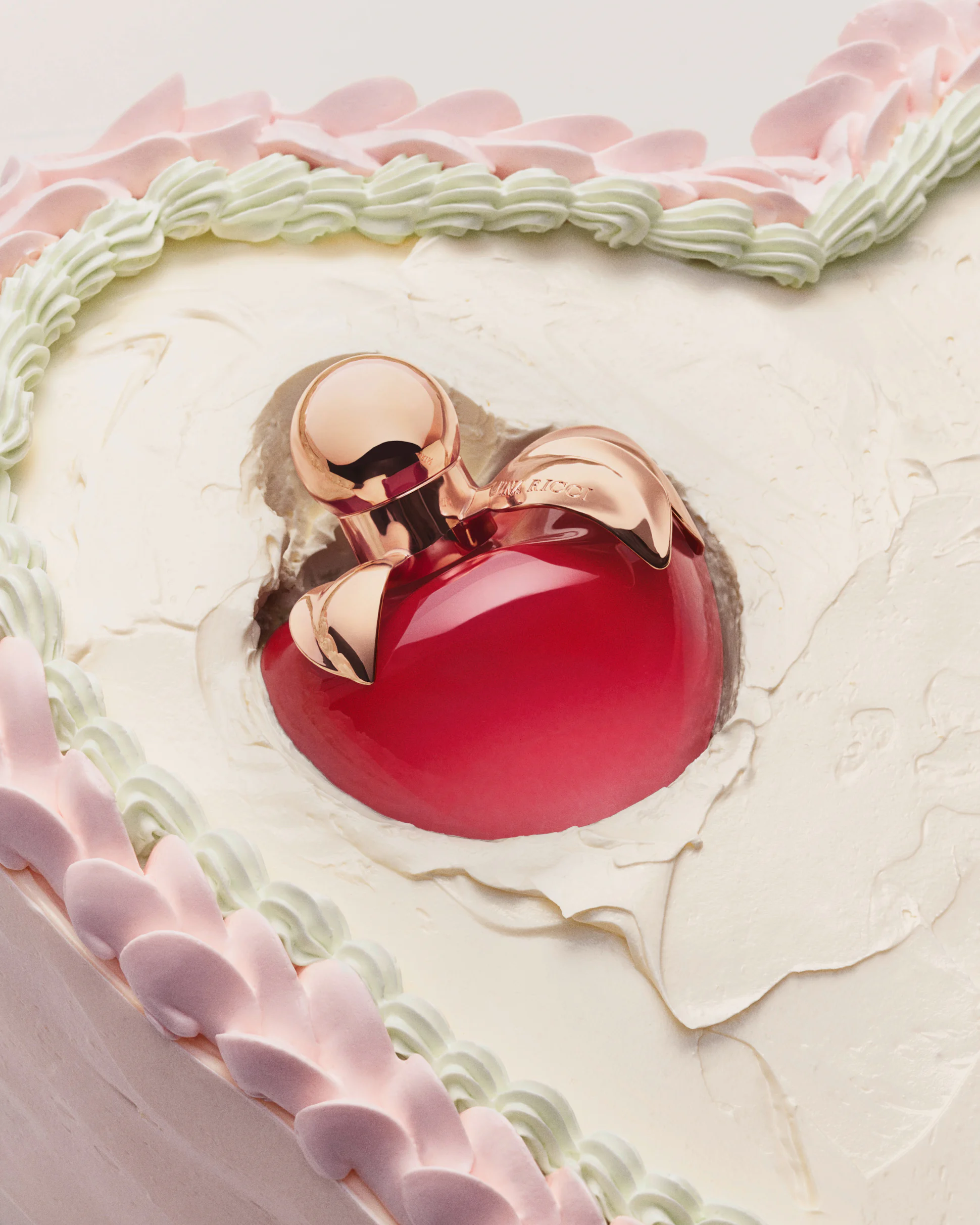 Nina Eau de Parfum on a cake