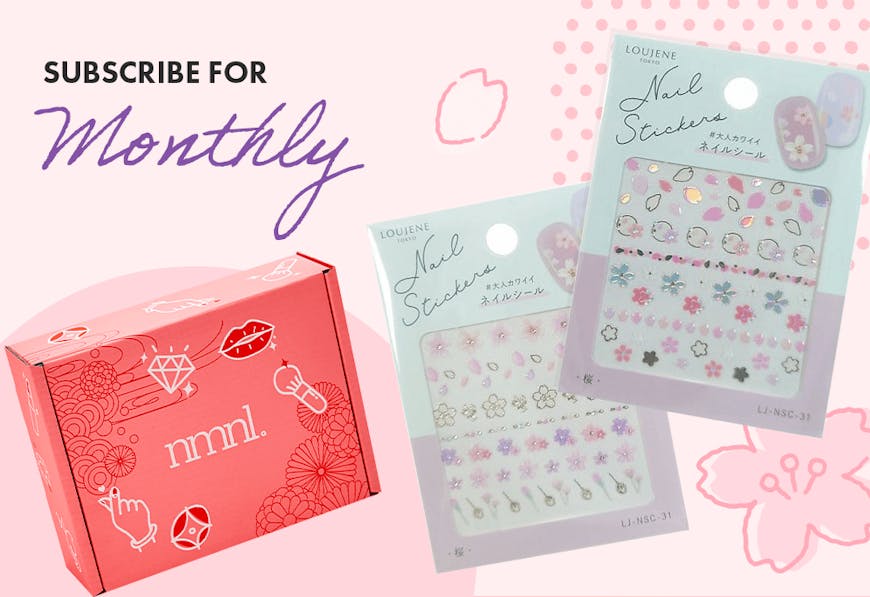 A promotion for nomakenolife's April box Spring Beauty Secrets, for a Cherry Blossom nail sticker set with code BLOOM23