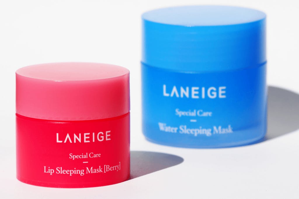Two packs of Laneiege's Korean lip masks made for overnight wear for soft lips, one red for berry, and one blue for water
