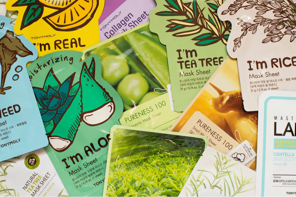 A pile of sheet masks from brands like Tony Moly with many natural ingredients.