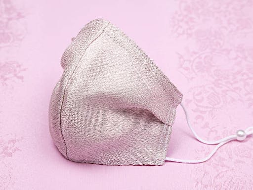 A pink Japanese face mask 