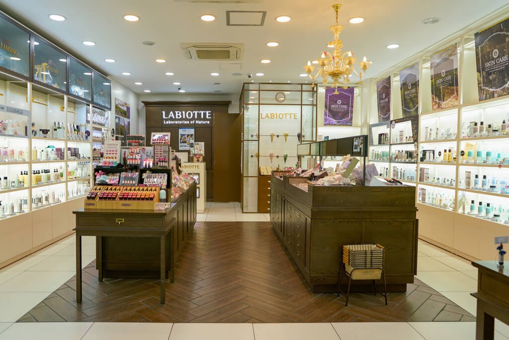 The inside of a Labiotte store with two islands of products in the middle of the store