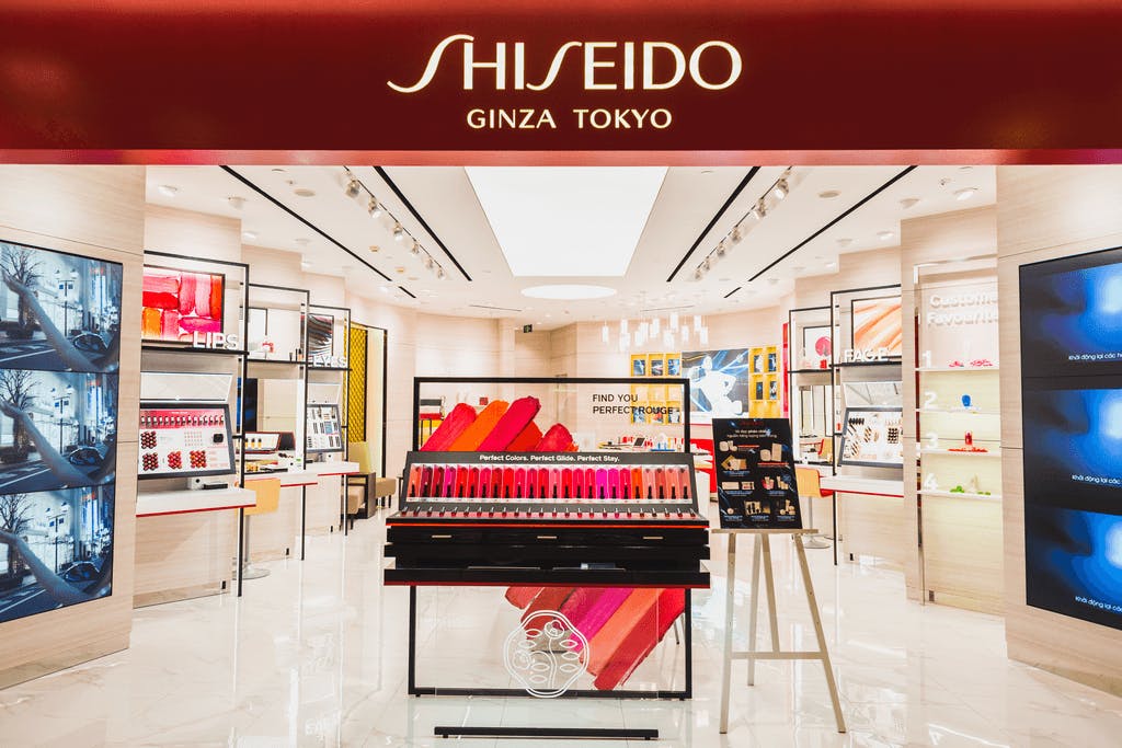The storefront for the Ginza branch of Shiseido, one of the biggest Japanese cosmetic brands with many items on display in the background.