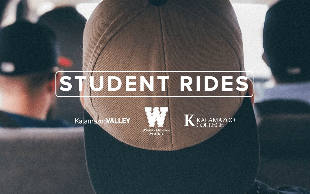 College students riding in a car together.